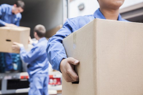 Man with a van loading a sofa for furniture transport