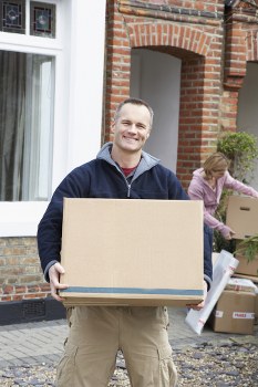 Moving team protecting furniture during a removals service