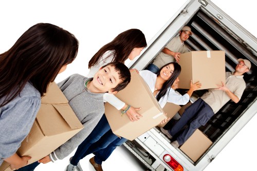 House removalists carefully wrapping furniture before a home move