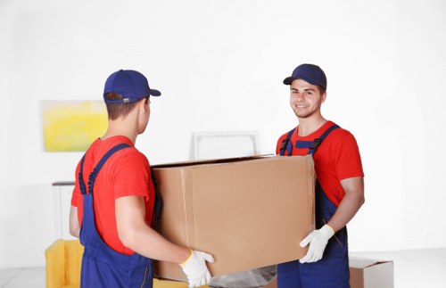 Furniture removals team collecting reusable items for recycling and donation