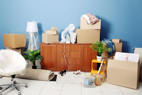 Furniture removal team preparing a sofa for safe transport
