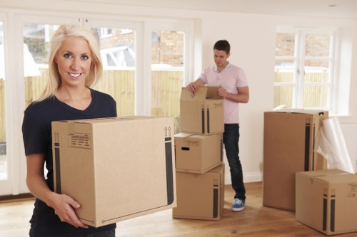 Office furniture pickup with desks and chairs ready for transport