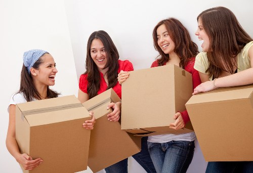 Team using proper lifting techniques in furniture removals