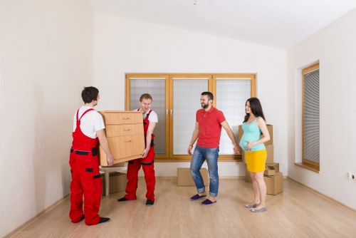Removal staff loading furniture with care during a UK move