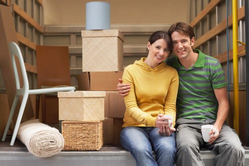 Careful loading of a piano into a moving truck for relocation