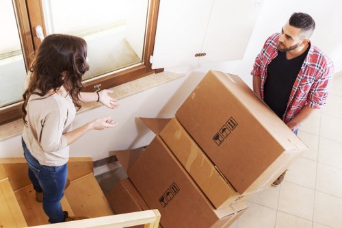 Furniture being carefully moved into a removal vehicle