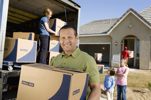 Flat removals equipment and packed furniture in a building
