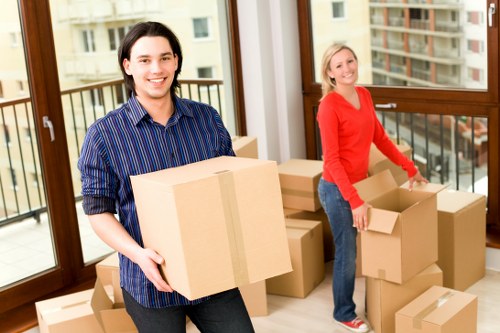 Professional furniture removals service loading office desks and chairs
